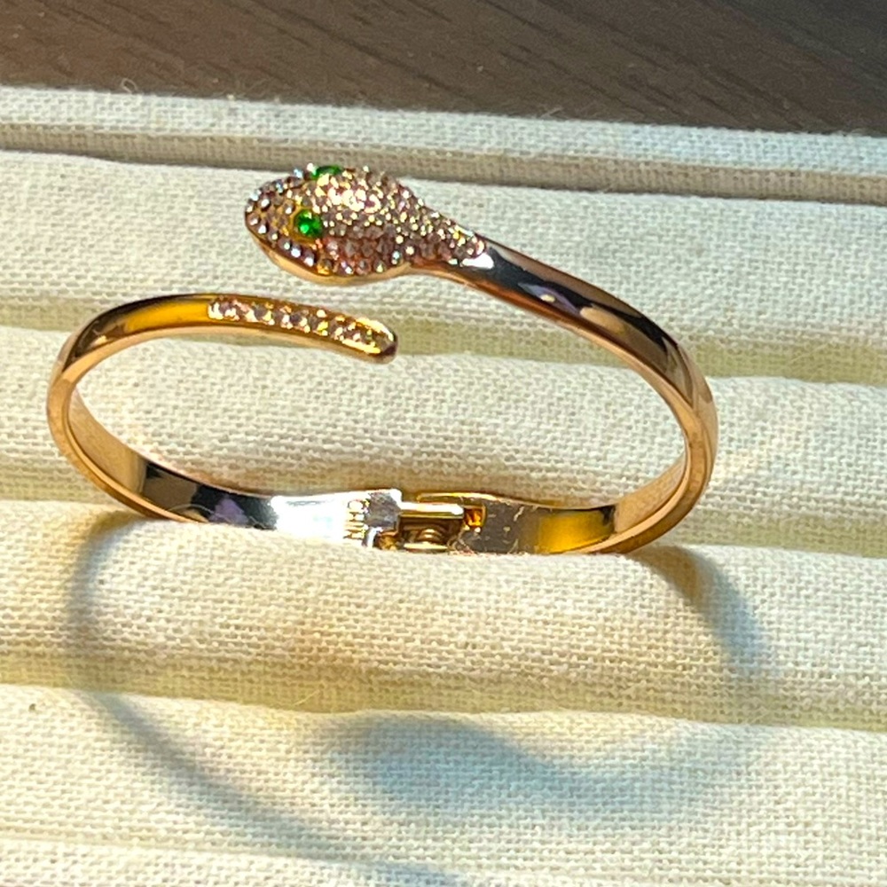 Rhinestone gold enameled snake bypass bracelet
